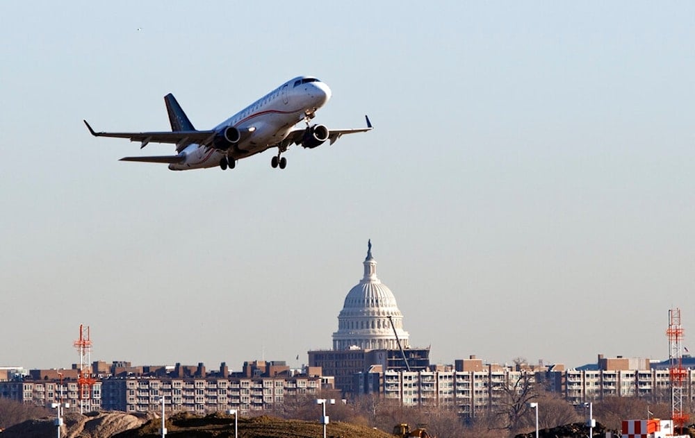 A Republic Airways jet takes off from Reagan National Airport in Washington, Thursday, Feb. 23, 2012. The Capitol is seen across the Potomac River. (AP Photo/J. Scott Applewhite)