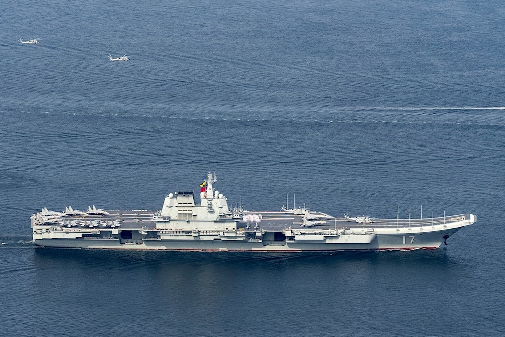 The Shandong aircraft carrier sails to dock in Hong Kong. 