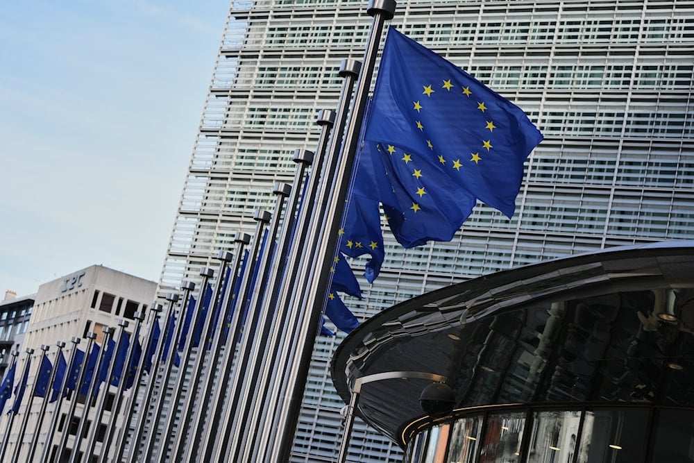 European Union flags flap in the wind outside of EU headquarters in Brussels, Tuesday, Nov. 4, 2025 (AP)