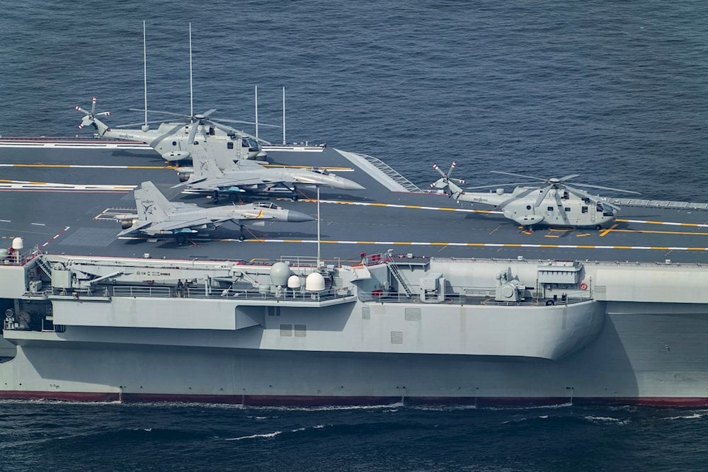 Z-18J helicopters are stowed on the deck of the Shandong aircraft carrier.