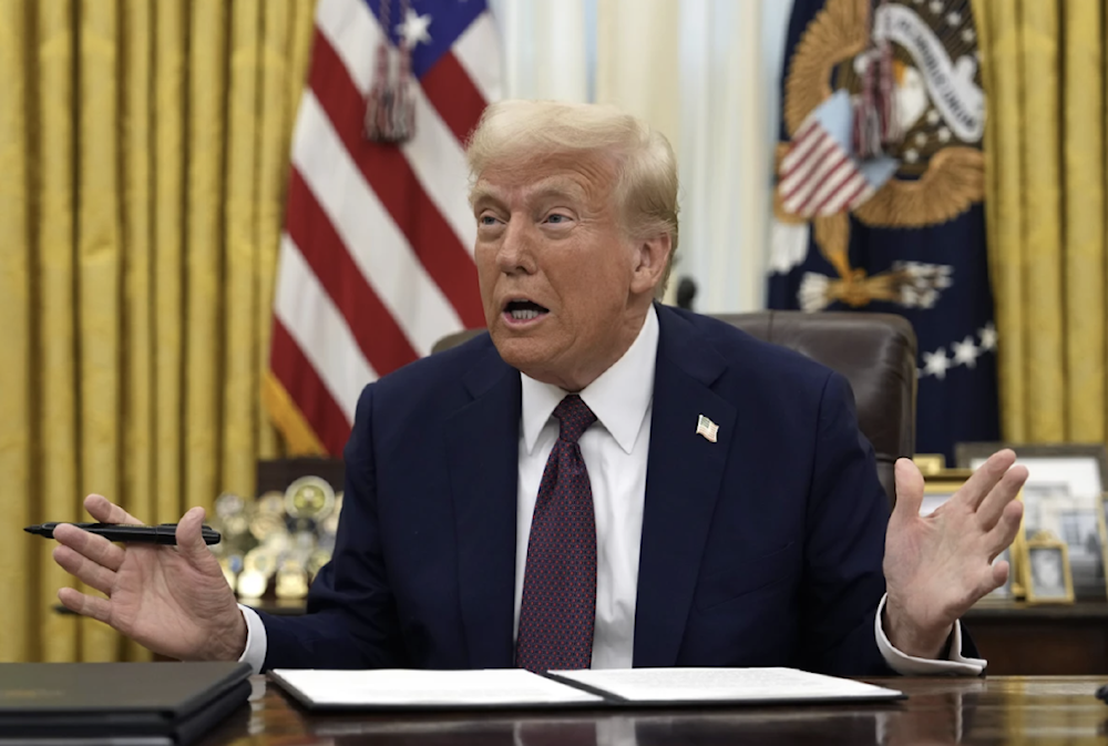 President Donald Trump talks as he signs an executive order giving federal recognition to the Limbee Tribe of North Carolina in the Oval Office on January 23, 2025 in Washington. (AP)