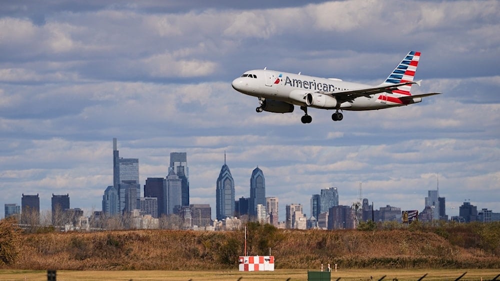 An aircraft lands at Philadelphia International Airport in Philadelphia, Thursday, November 6, 2025 (AP)