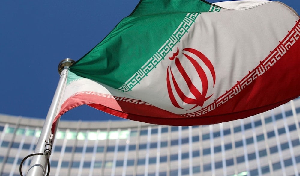 The Iranian flag flies in front of a U.N. building where closed-door nuclear talks take place at the International Center in Vienna, Austria, on June 18, 2014. (AP)