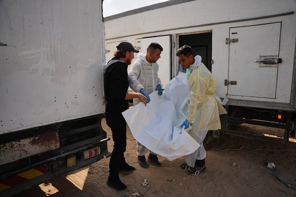 Bodies of unidentified Palestinians returned from Israel as part of the ceasefire deal are brought to Nasser Hospital in Khan Younis, Gaza Strip, Saturday, Nov. 8, 2025. (AP Photo/Abdel Kareem Hana)