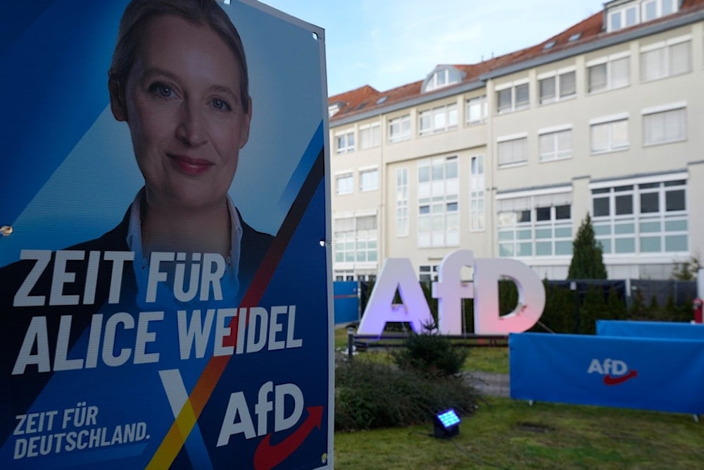 Poster with leader of far right AfD Alice Weidel is placed at the AfD party headquarters in Berlin, Germany, Sunday, Feb. 23, 2025, during the German national election. (AP Photo/Michael Probst)