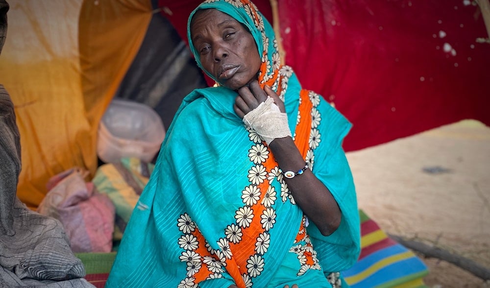 FILE - A woman who fled el-Fasher, after Sudan's paramilitary forces killed hundreds of people in the western Darfur region, rests at a camp in Tawila, Sudan, Oct. 31, 2025. (AP)