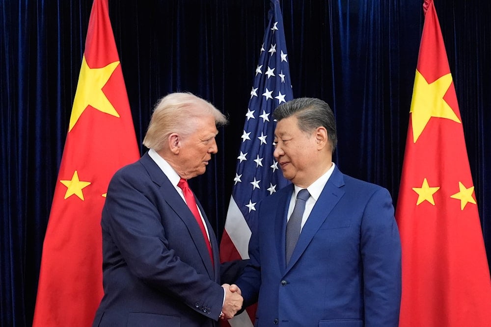 President Donald Trump, left, and Chinese President Xi Jinping, right, shake hands before their meeting at Gimhae International Airport in Busan, South Korea, Thursday, Oct. 30, 2025 (AP)
