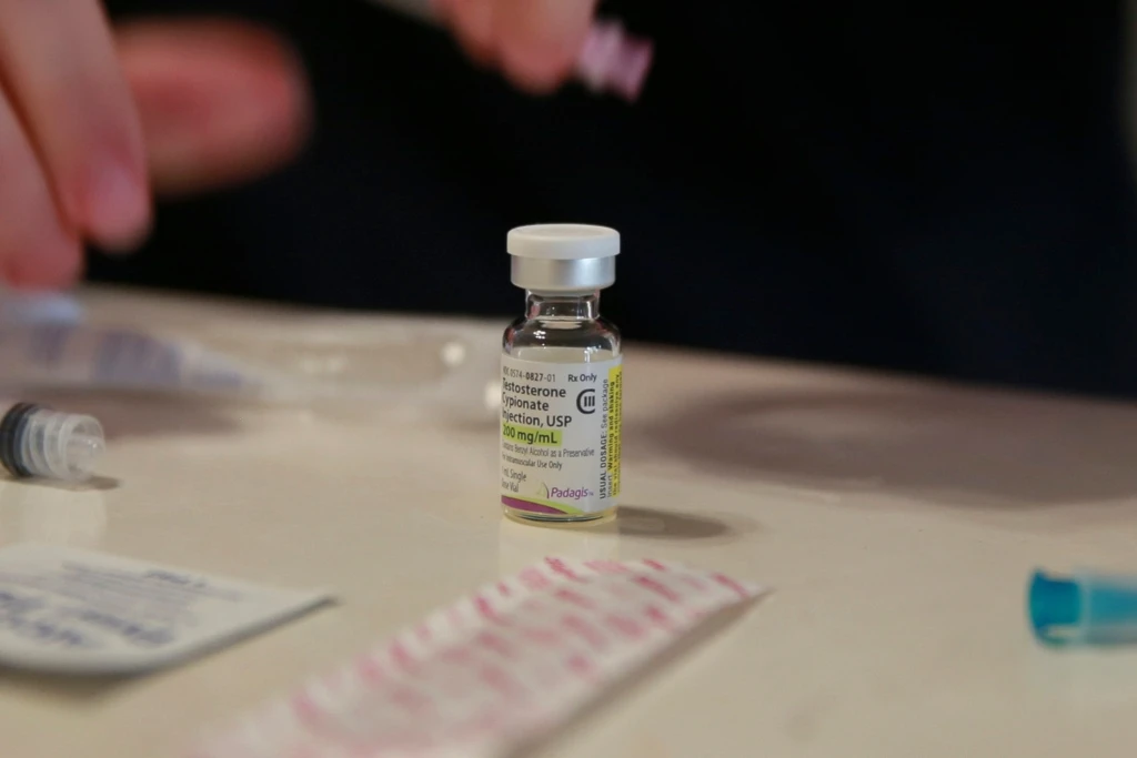 A vial of testosterone is prepared for injection at a home in Florida, on May 29, 2023. (AP Photo/Laura Bargfeld)