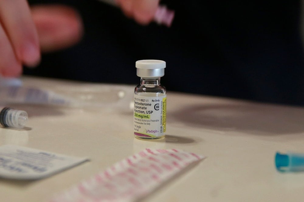 A vial of testosterone is prepared for injection at a home in Florida, on May 29, 2023. (AP Photo/Laura Bargfeld)