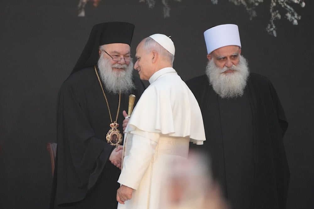 Pope Leo XIV meets the Greek Orthodox Patriarch of Antioch John X Yazigi, left, and spiritual leader of Lebanon's Druze community Sheikh Sami Abi al-Mona in the Martyrs' Square, in Beirut, Monday, December 1, 2025 (AP)