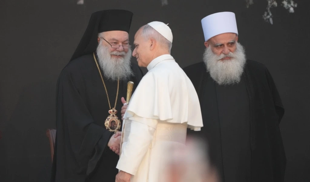 Pope Leo XIV meets the Greek Orthodox Patriarch of Antioch John X Yazigi, left, and spiritual leader of Lebanon's Druze community Sheikh Sami Abi al-Mona in the Martyrs' Square, in Beirut, Monday, December 1, 2025 (AP)