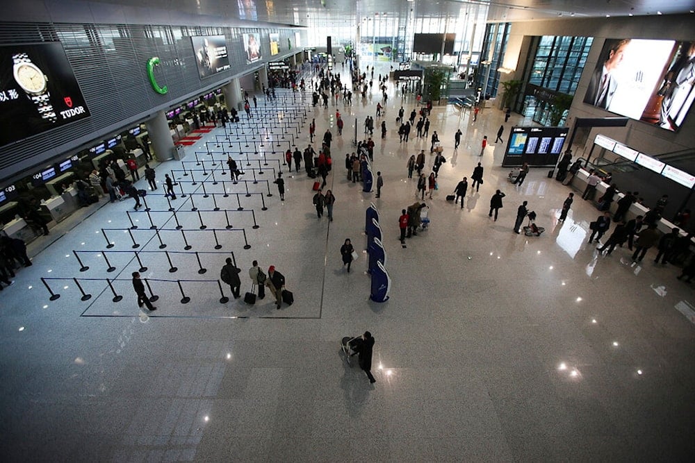 People walk on the departure level floor at Hongqiao Airport's new second terminal Tuesday, March 16, 2010 in Shanghai, China.  (AP)