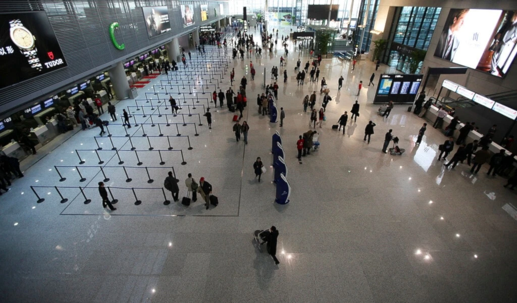People walk on the departure level floor at Hongqiao Airport's new second terminal Tuesday, March 16, 2010 in Shanghai, China.  (AP)