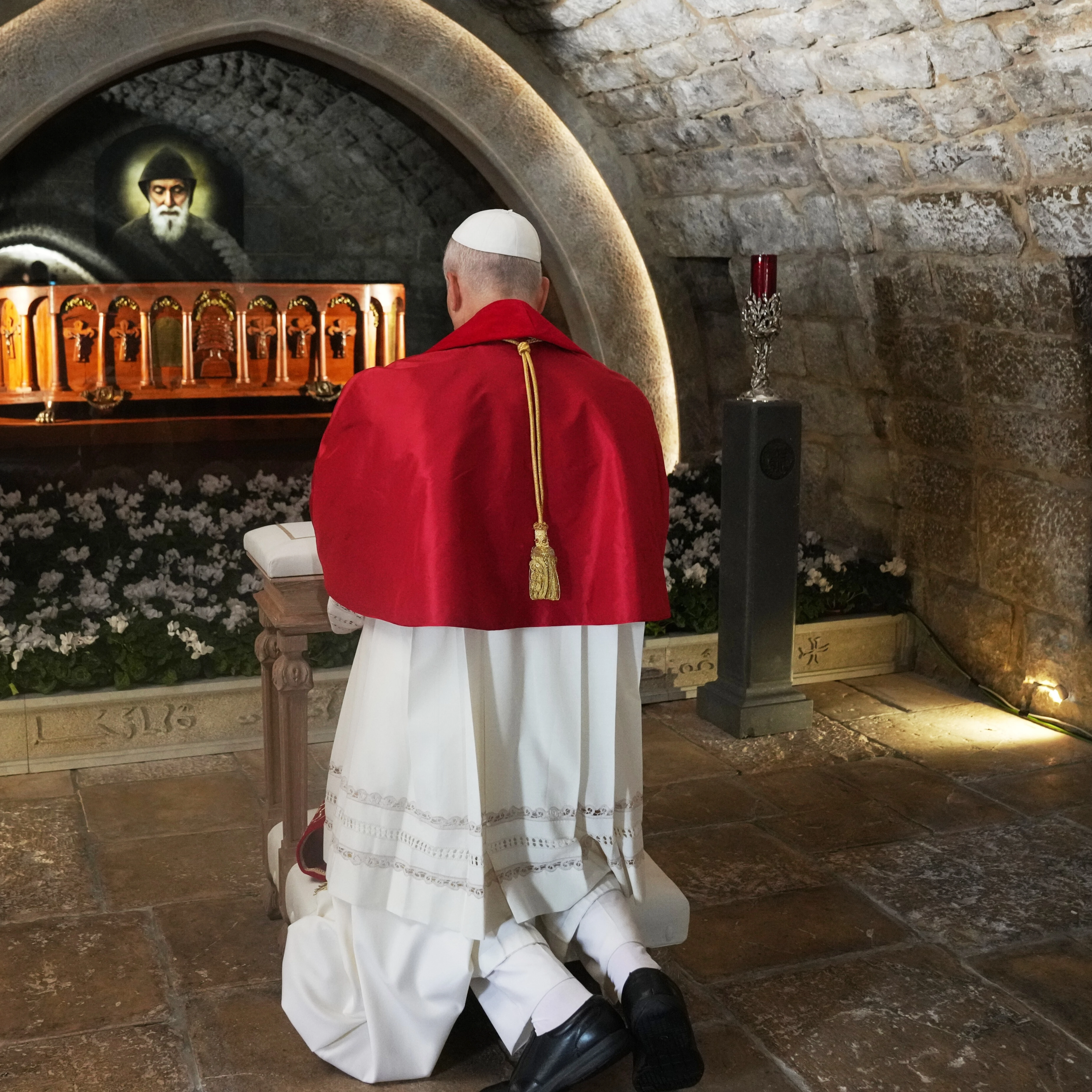 Pope Leo XIV prays in front of the tomb of Saint Charbel Makhlouf at the Monastery of Saint Maroun, in Annaya, Lebanon, Monday, Dec. 1, 2025 (AP)