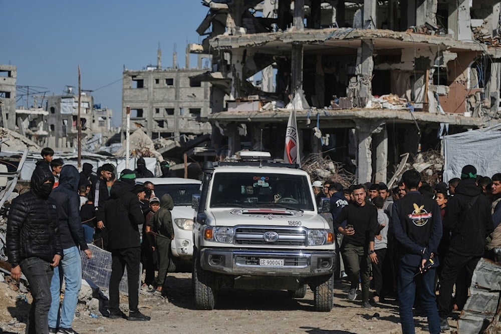 Members of the International Committee of the Red Cross (ICRC) arrive at the site where Hamas fighters are searching for the remains of captives in Jabalia, northern Gaza Strip, Monday, December 1, 2025 (AP)