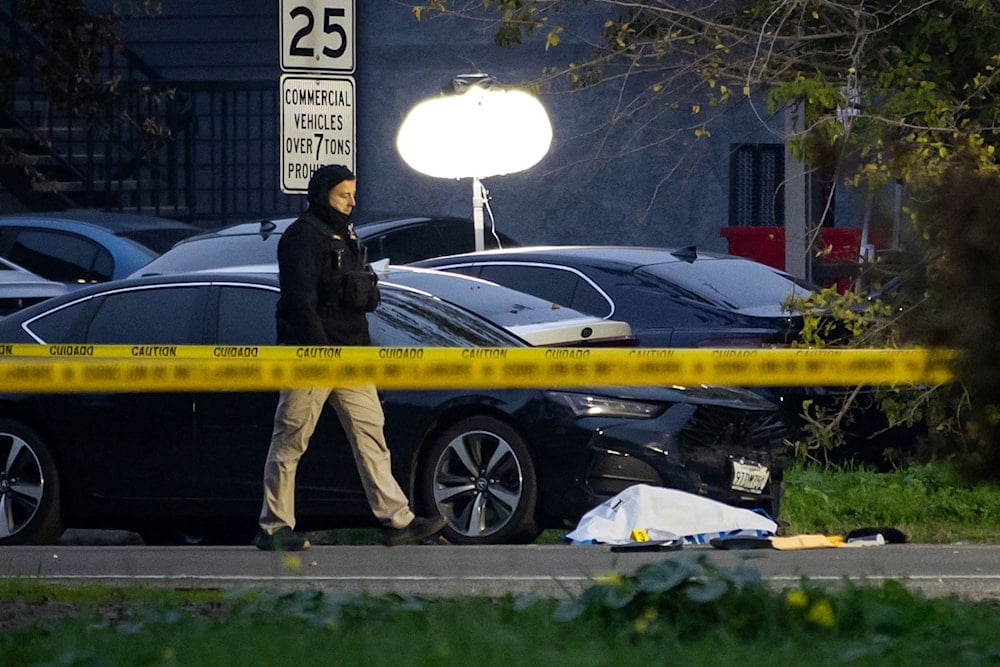Investigators examine the scene of a mass shooting Sunday, Nov. 30, 2025, in Stockton, California (AP)