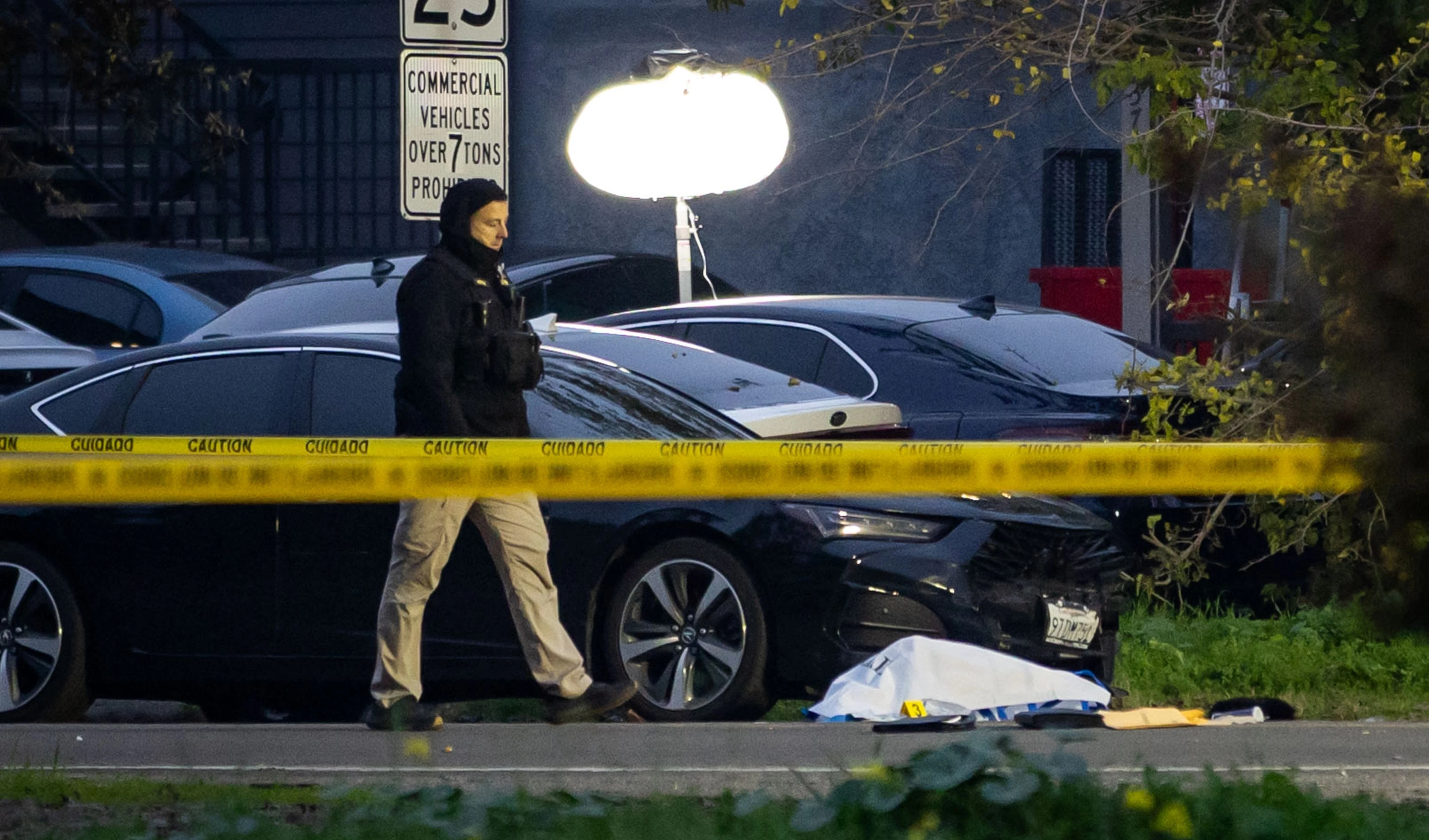 Investigators examine the scene of a mass shooting Sunday, Nov. 30, 2025, in Stockton, California (AP)