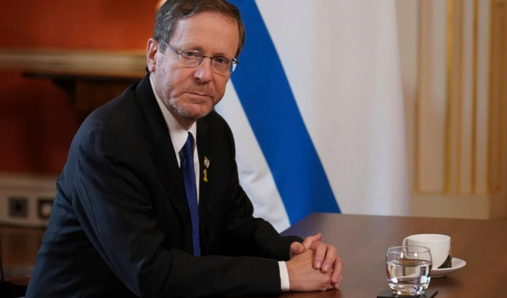 Israel's President Isaac Herzog sits at a table as he speaks to Britain's Prime Minister Keir Starmer at 10 Downing Street in London, Wednesday, Sept. 10, 2025.(AP Photo/Alberto Pezzali, Pool)