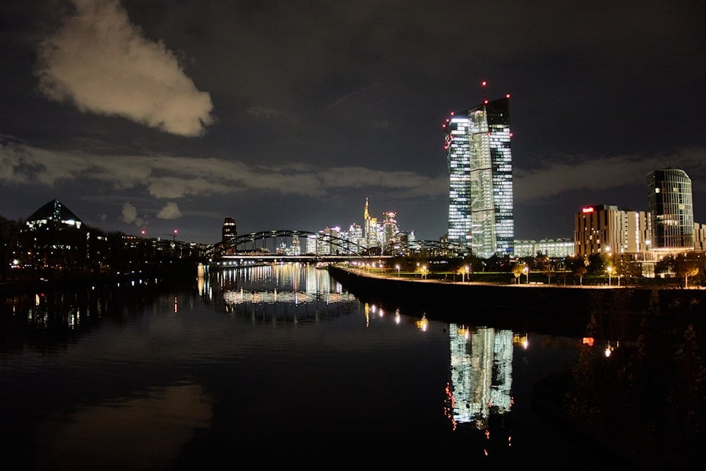 The European Central Bank is reflected in the river Main in Frankfurt, Germany, late Thursday, Nov. 20, 2025 (AP)