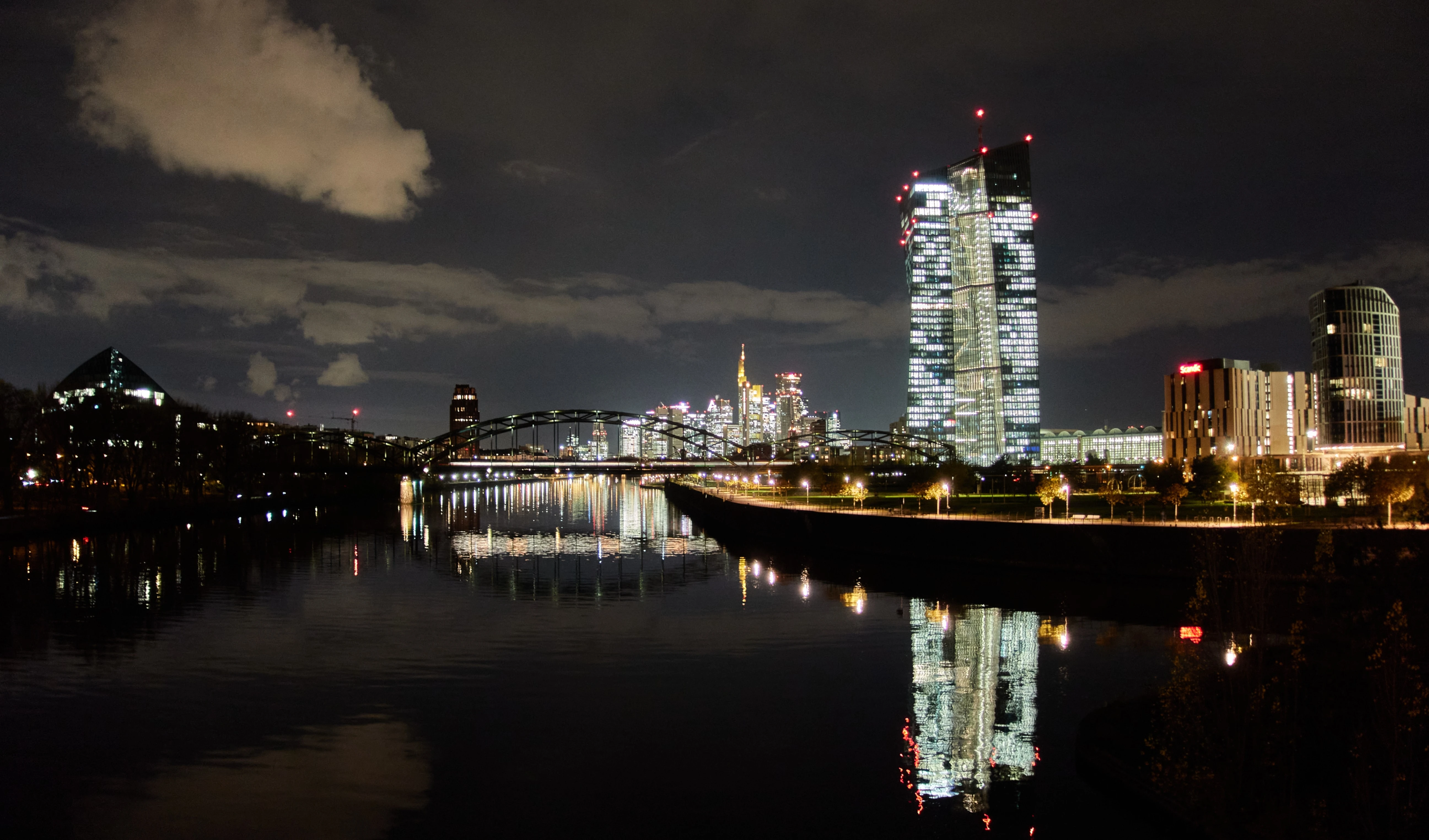 The European Central Bank is reflected in the river Main in Frankfurt, Germany, late Thursday, Nov. 20, 2025 (AP)