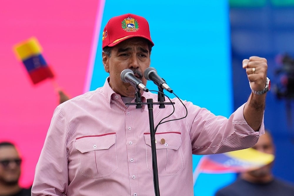 Venezuelan President Nicolas Maduro addresses supporters during a swearing-in event for government-organized community committees at the presidential palace in Caracas, Venezuela, Monday, December 1, 2025 (AP)