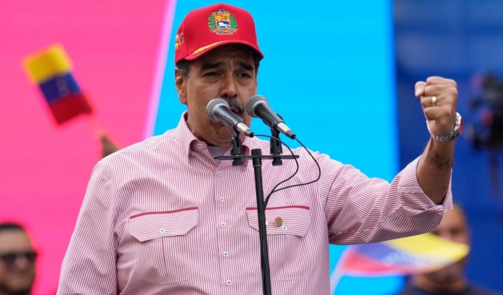 Venezuelan President Nicolas Maduro addresses supporters during a swearing-in event for government-organized community committees at the presidential palace in Caracas, Venezuela, Monday, December 1, 2025 (AP)