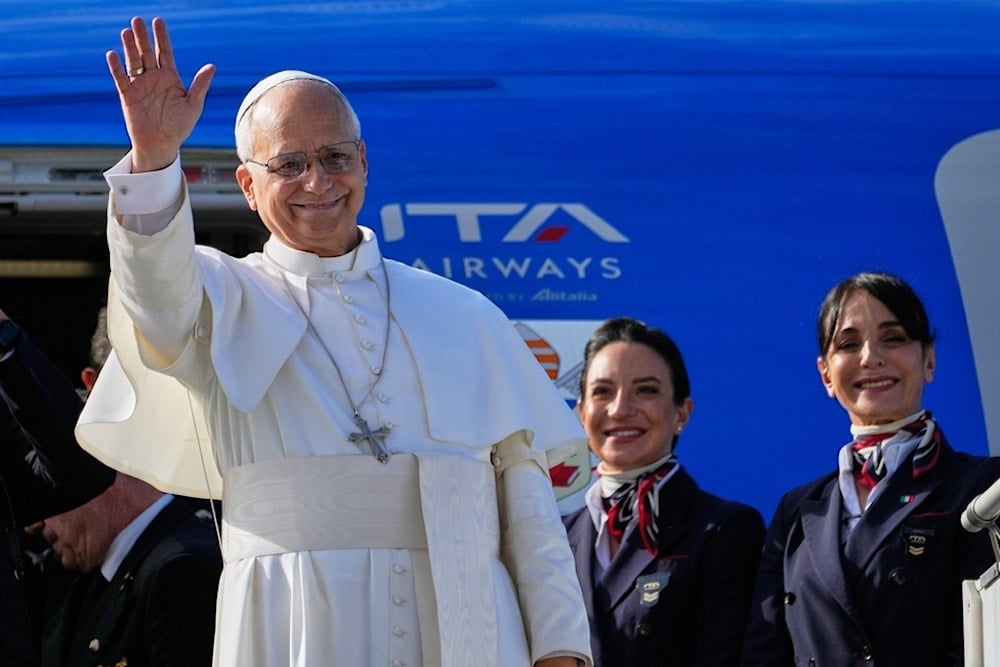 Pope Leo XIV waves as he boards a flight back to the Vatican after his visit to Lebanon at Beirut International Airport in Beirut, Lebanon, Tuesday, December 2, 2025 (AP)