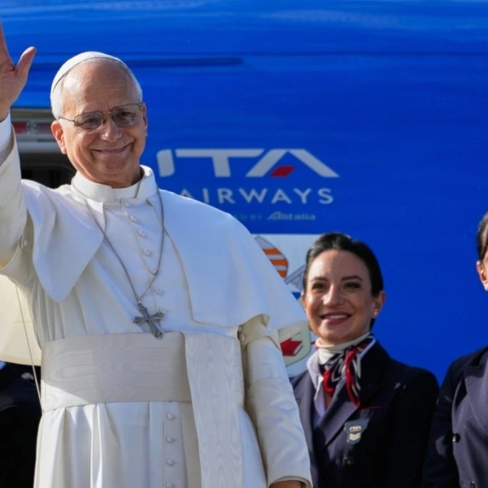Pope Leo XIV waves as he boards a flight back to the Vatican after his visit to Lebanon at Beirut International Airport in Beirut, Lebanon, Tuesday, December 2, 2025 (AP)