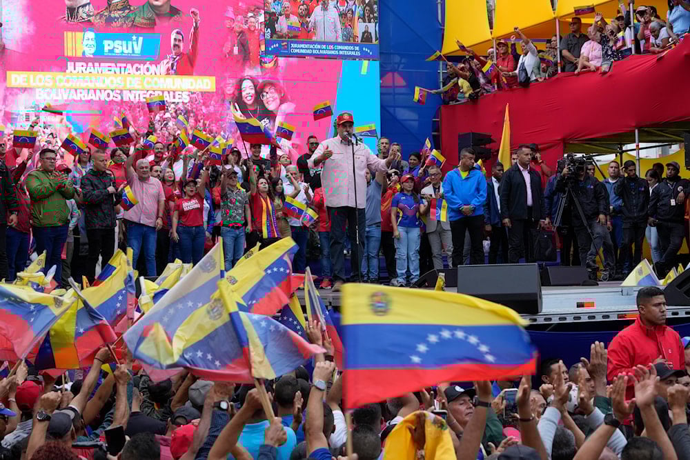 Venezuelan President Nicolas Maduro addresses supporters during a swearing-in event for government-organized community committees at the presidential palace in Caracas, Venezuela, Monday, Dec. 1, 2025 (AP)