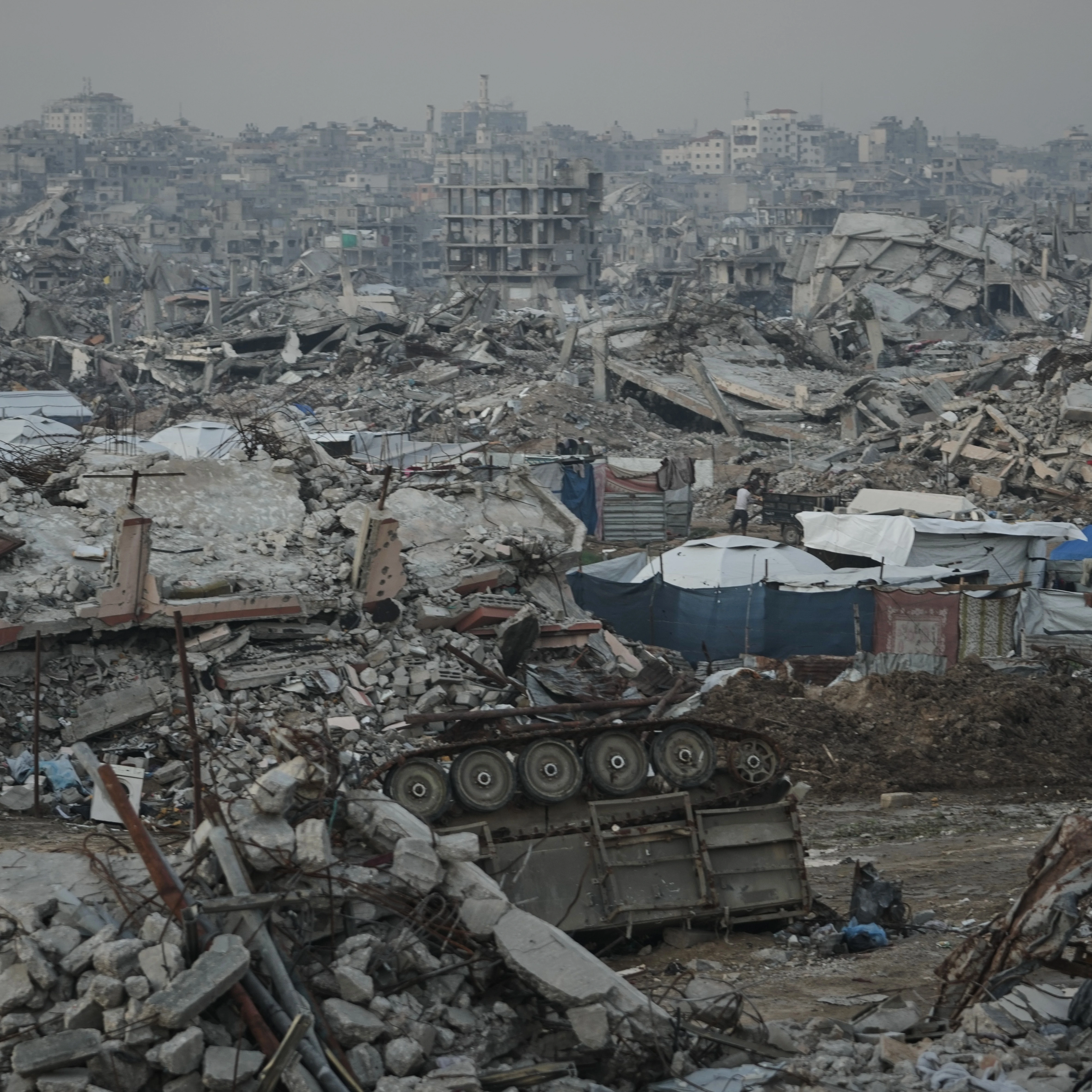 A destroyed Israeli armored vehicle sits amid widespread devastation in Gaza City Thursday, Nov. 27, 2025 (AP)