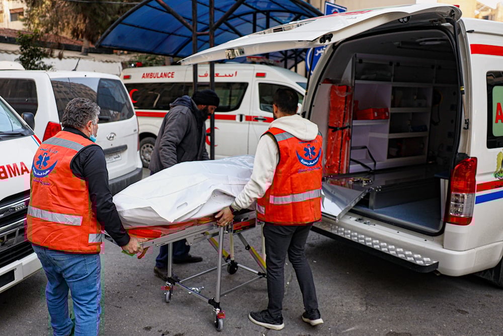 The body of one of the victims of an Israeli forces raid in the southern Syrian village of Beit Jin is brought to Al-Mowasat Hospital in Damascus, Friday, Nov. 28, 2025 (AP)