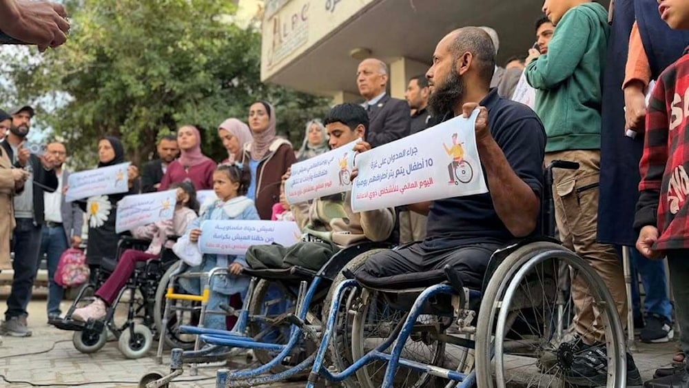 Palestinian amputees hold banners in front of the Prosthetic Center in Gaza, Occupied Palestine, December 3, 2025 (social media)
