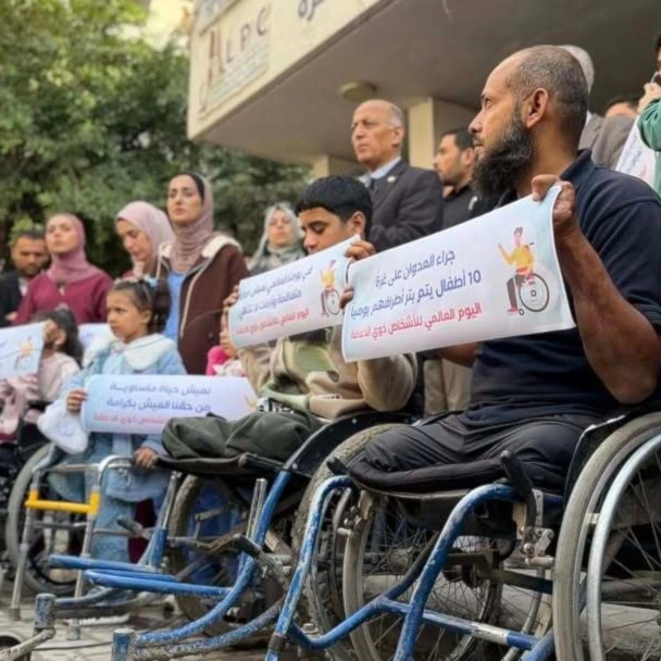Palestinian amputees hold banners in front of the Prosthetic Center in Gaza, Occupied Palestine, December 3, 2025 (social media)