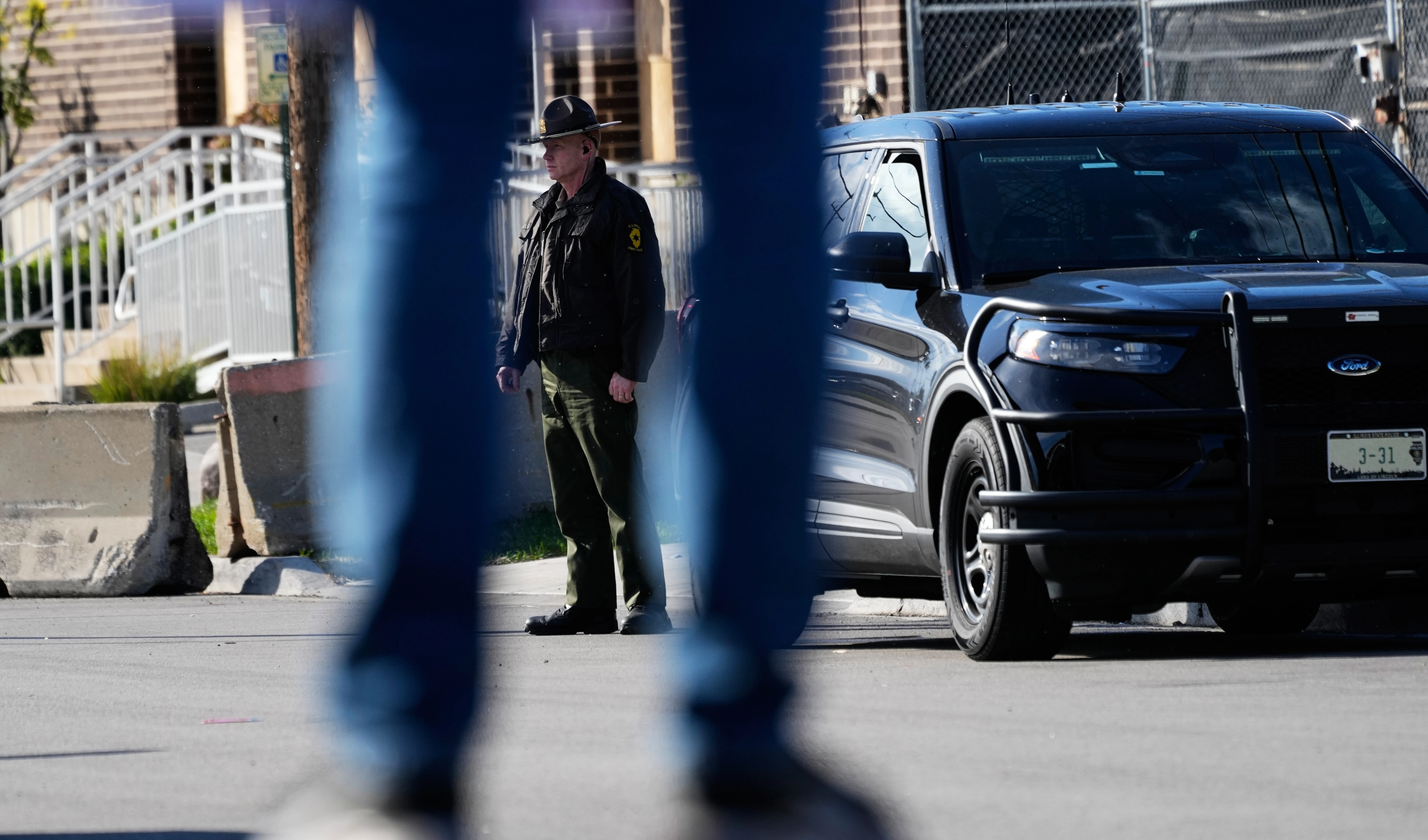 A Illinois State Police officer stands outside an ICE (U.S. Immigration and Customs Enforcement) processing facility in the Chicago suburb of Broadview, Ill., on October 21, 2025. (AP Photo/Nam Y. Huh)