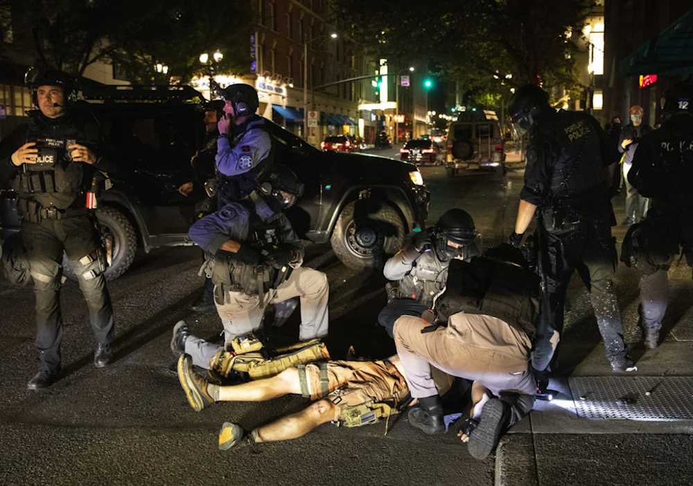 A man who later died is treated after being shot at a demonstration in Portland, Oregon on August 29, 2020. (AP)