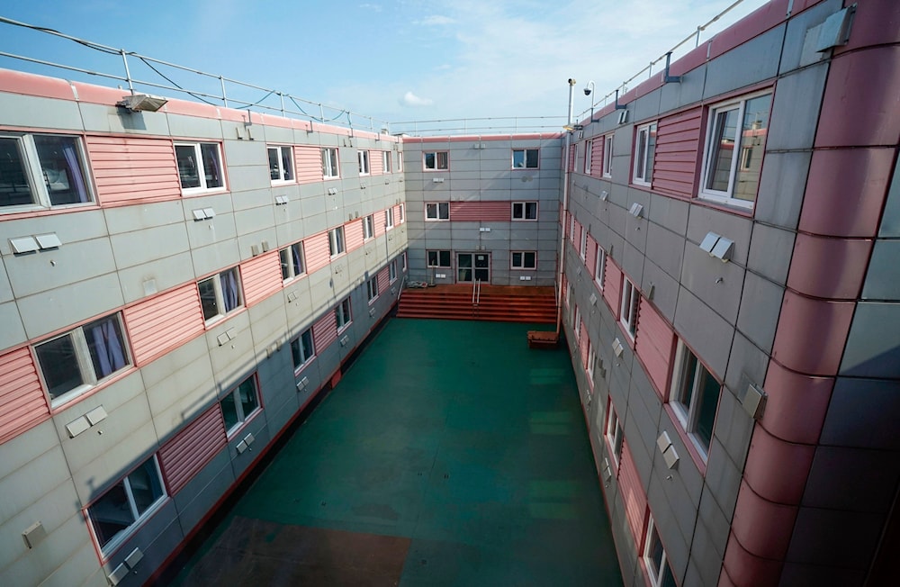 Courtyard for fitness equipment on the Bibby Stockholm asylum barge, Portland Port, Dorset, July 21, 2023. (AP)