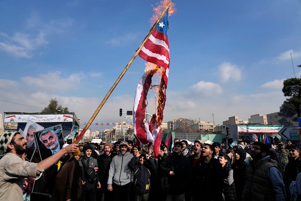 Iranian demonstrators burn a representation of the U.S. flag during a rally commemorating anniversary of 1979 Islamic Revolution that toppled the late pro-U.S. Shah Mohammad Reza Pahlavi, in Tehran, Iran, Monday, Feb. 10, 2025. (AP)