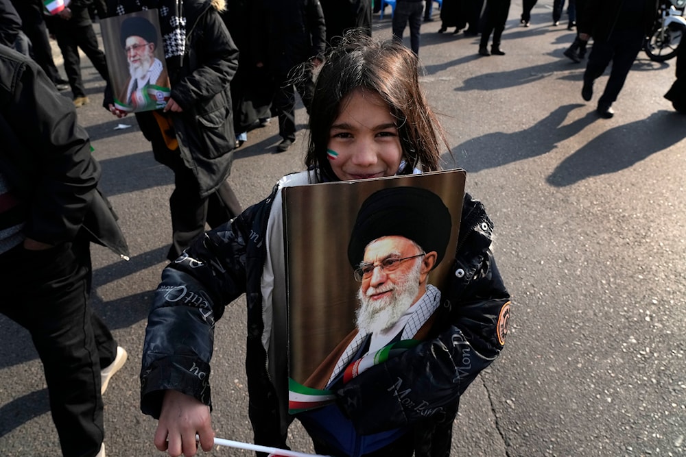 A girl holds a poster of the Iranian Supreme Leader Ayatollah Ali Khamenei during a rally commemorating anniversary of 1979 Islamic Revolution that toppled the late pro-U.S. Shah Mohammad Reza Pahlavi, in Tehran, Iran, Monday, Feb. 10, 2025. (AP)