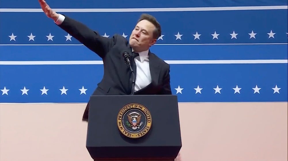 Elon Musk gestures while speaking at an indoor Presidential Inauguration parade event in Washington, Monday, Jan. 20, 2025. (AP)