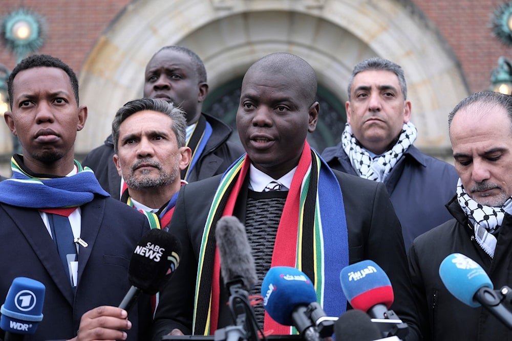 South Africa's Minister of Justice Ronald Lamola address the media outside the International Court of Justice in The Hague, Netherlands, Thursday, Jan. 11, 2024. (AP)