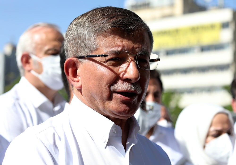 Former prime minister and opposition Future Party leader Ahmet Davutoglu speaks to the media outside the parliament May 26, 2021 (AP) 