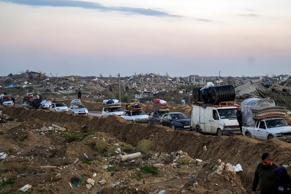 Displaced Palestinians make their way from central Gaza to their homes in the northern Gaza Strip, on February 10, 2025. (AP Photo/Abdel Kareem Hana)