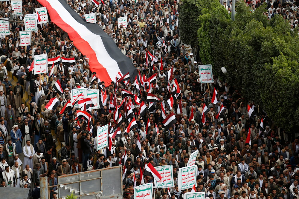 Houthi supporters chant slogans as they attend a rally marking eight years for a Saudi-led coalition, Friday, March 26, 2023 (AP)