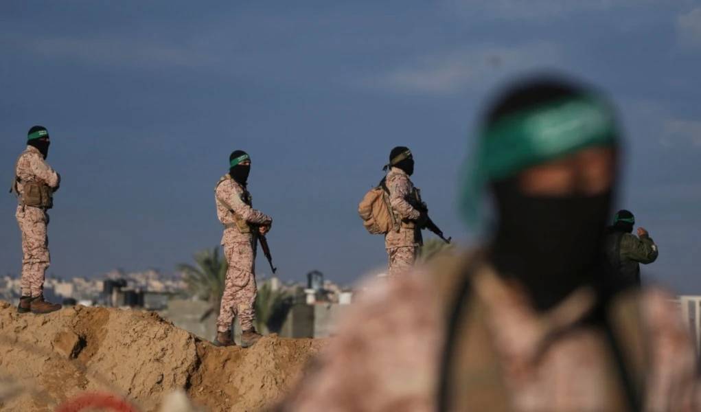 Hamas fighters take up positions ahead of the release of a captive as he is being handed over to the Red Cross in Khan Younis, southern Gaza Strip, Saturday, Feb. 1, 2025. (AP)
