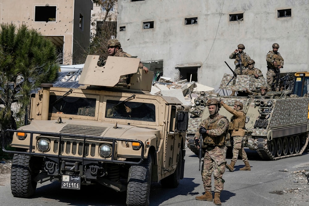 Lebanese soldiers enter a neighborhood in the southern Lebanese village of Aitaroun, Lebanon, Monday, Jan. 27, 2025 (AP)