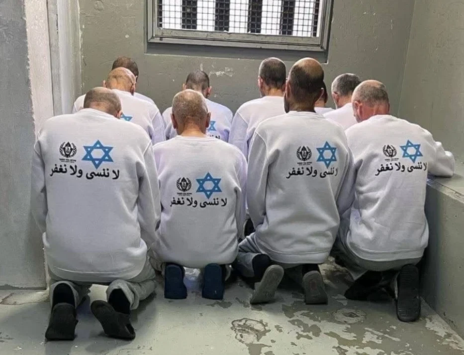 Freed Palestinian prisoners forced to wear uniforms by Israeli authorities, marked with a blue Star of David and inscribed with the phrase: 'We do not forget, and we do not forgive,' on February 15, 2025 (Social media)