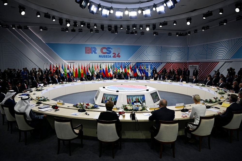 Russian President Vladimir Putin speaks at BRICS Summit extended format session in Kazan, Russia, Wednesday, Oct. 23, 2024. (Alexander Nemenov, Pool Photo via AP)