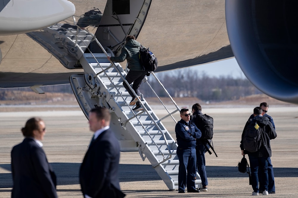 Members of the White House traveling press pool board Air Force One at Joint Base Andrews, Md., Friday, Feb. 14, 2025 (AP)