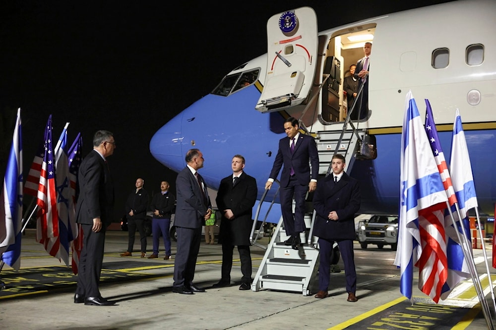 US Secretary of State Marco Rubio arrives in Tel Aviv, as Israeli Foreign Minister Gideon Sa'ar waits to welcome him at the Ben Gurion airport, occupied Palestine, Saturday, Feb. 15, 2025 (Reuters pool photo via AP)