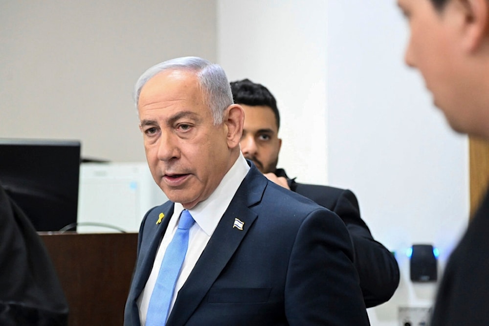 Israeli Prime Minister Benjamin Netanyahu attends his trial on corruption charges at the district court in Tel Aviv, occupied Palestine, Wednesday, Feb. 12, 2025 (AP)